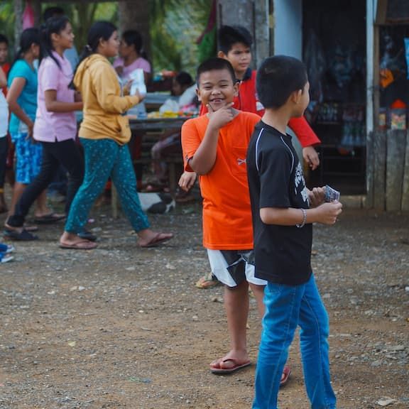 Smiling kid in front of a camera