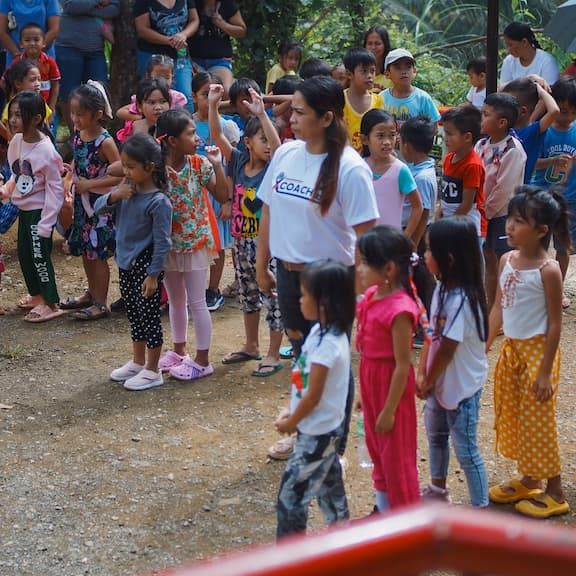 A group of kids gathered around