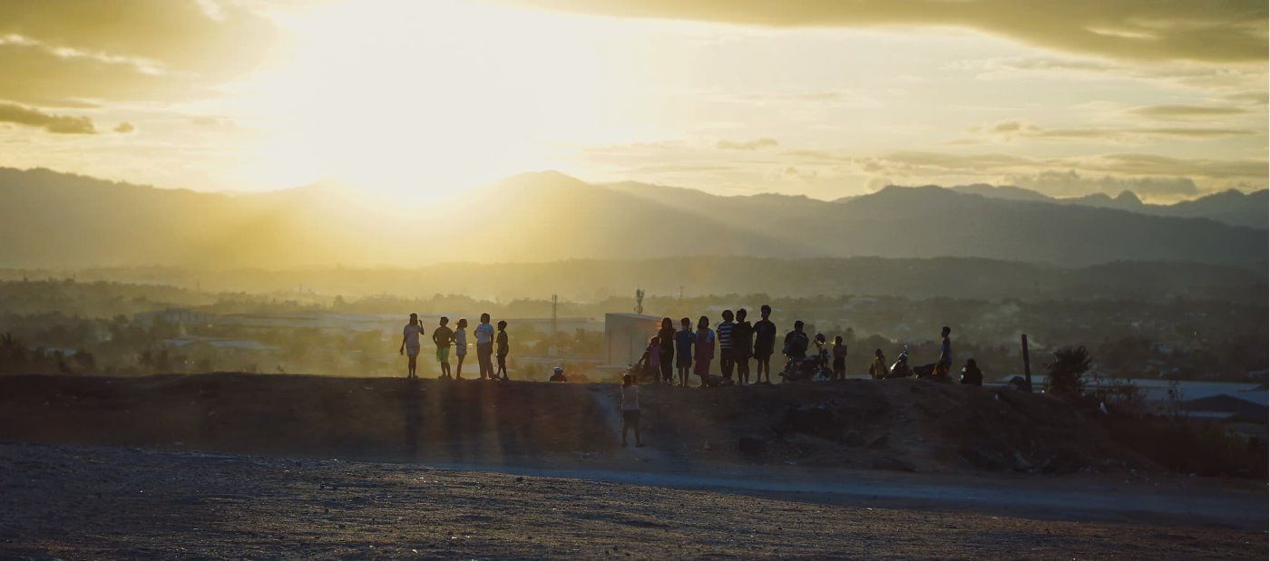 Image of people in a sunset